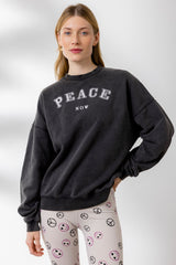 Hey Honey Yoga Peace Sweater in black, featuring stylish "PEACE NOW" graphic, perfect for yoga and casual wear.