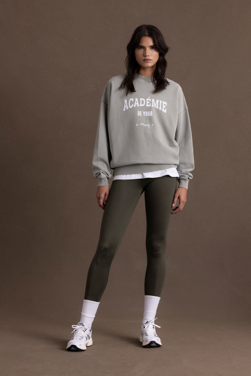 Model wearing Hey Honey "Forest Night" leggings paired with a grey sweatshirt for a casual athletic look.