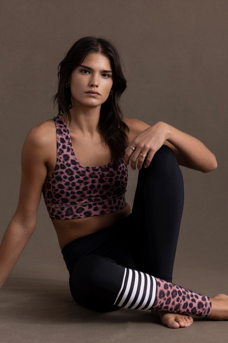 Model wearing Hey Honey Surf Style Leo Rose leggings and matching sports bra, showcasing trendy leopard print design.