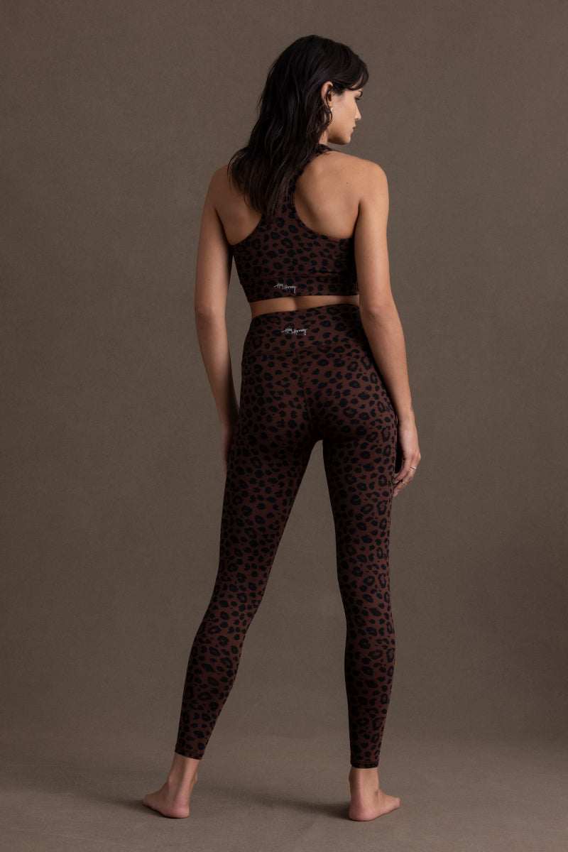 Stylish Hey Honey Leo Chocolate leggings with high waist and leopard print, perfect for yoga and fitness activities.