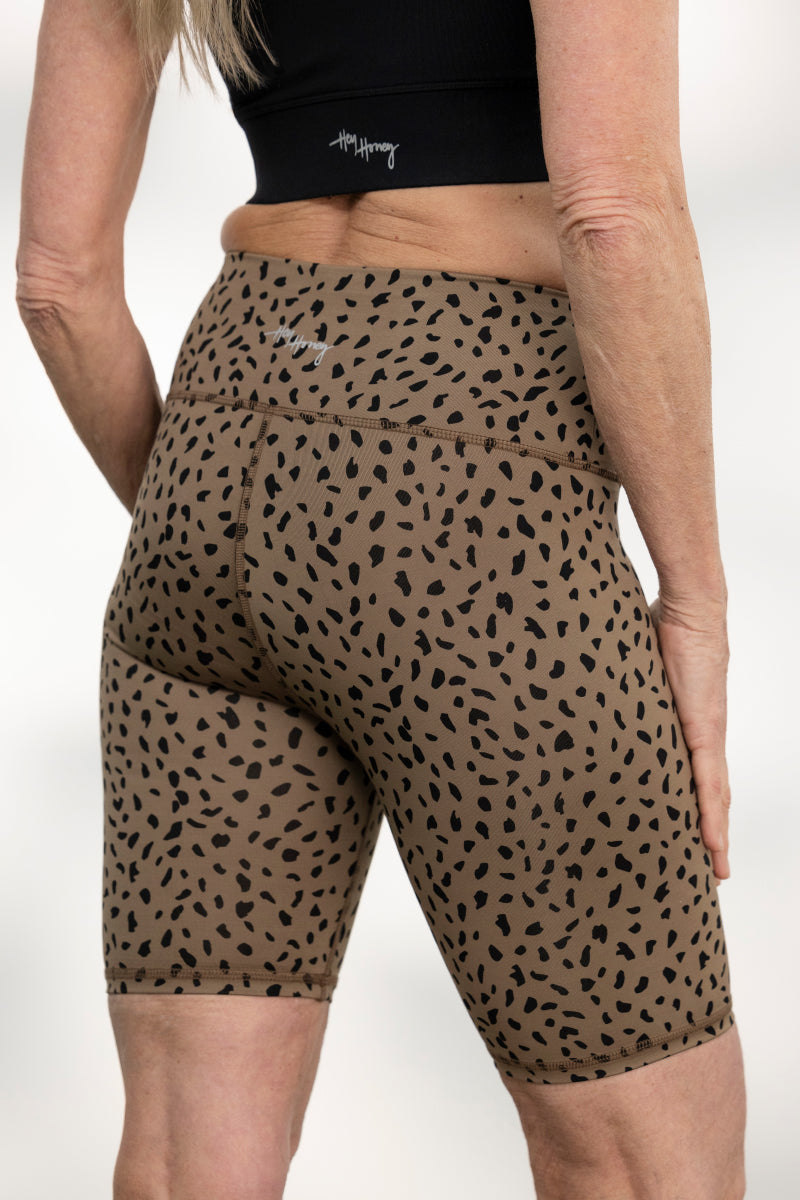 Comfortable high-waisted biker shorts in Caribou color with a stylish animal print design, perfect for workouts and casual wear.