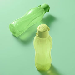 Two Tupperware EcoEasy bottles in green on a light green background, showcasing their ergonomic design and screw tops.