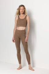 Model wearing Hey Honey Caribou leggings and matching top, showcasing comfort and style for yoga and casual wear.