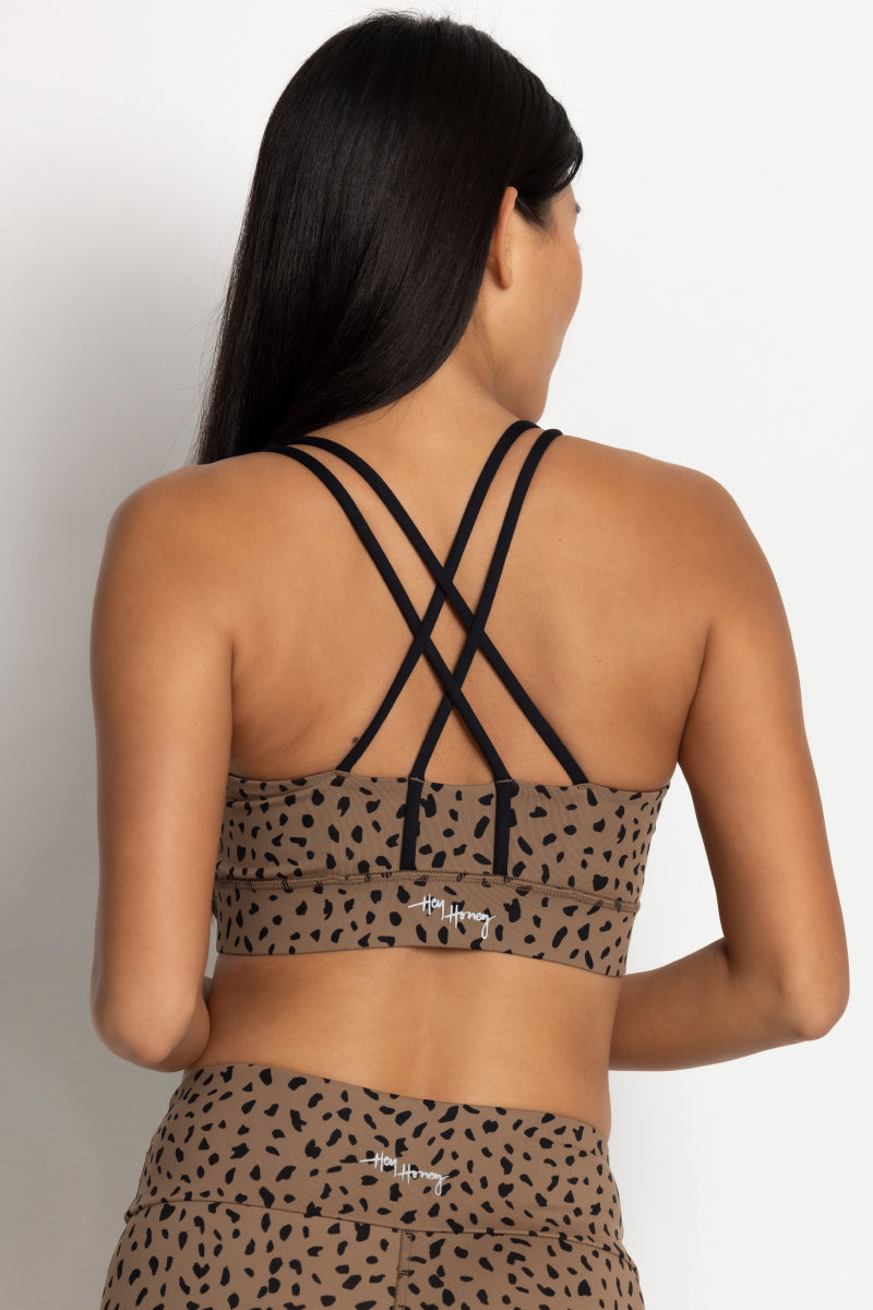 Criss-cross back design of the Hey Honey Yoga Lessismore Bra in Caribou, highlighting its stylish and breathable features.