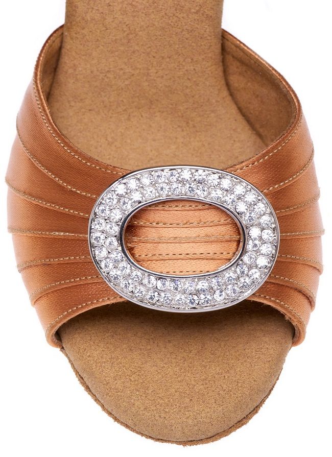 Close-up of Elite Cleopatra 048 sandal featuring crystal-embellished brooch and pleated leather design.