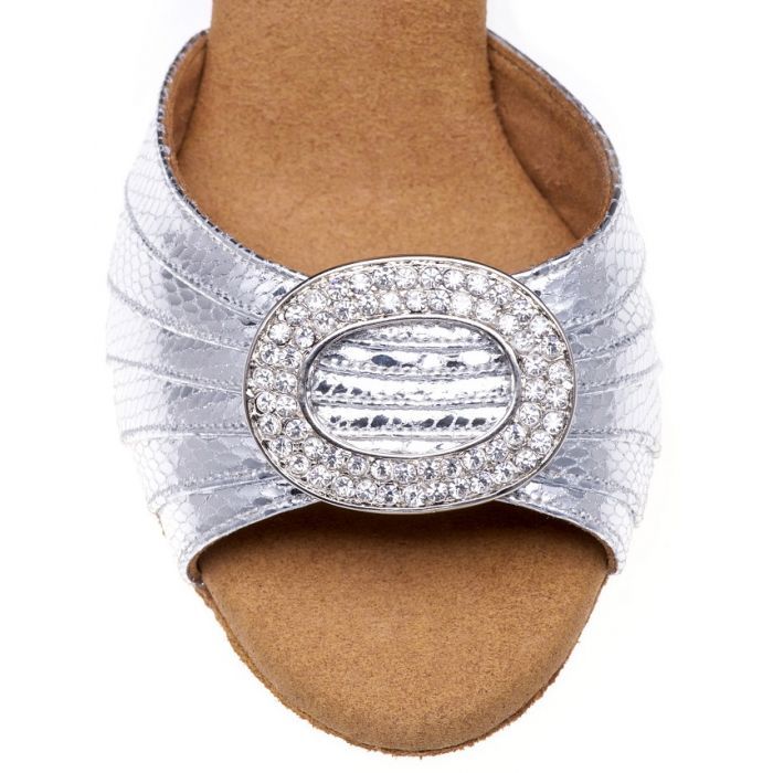 Elegant silver bridal shoe featuring crystal-embellished brooch, perfect for dance styles like Salsa and Tango.