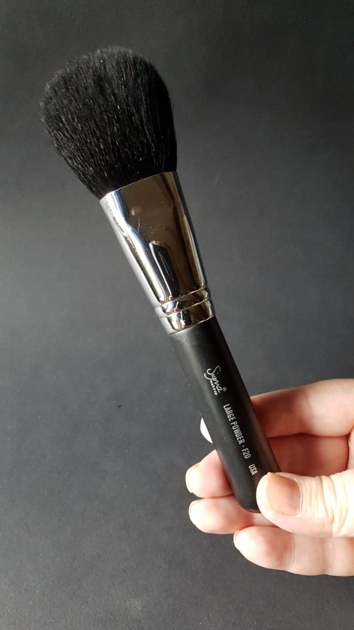 Sigma F30 large powder brush with soft bristles, ideal for even application of powders.