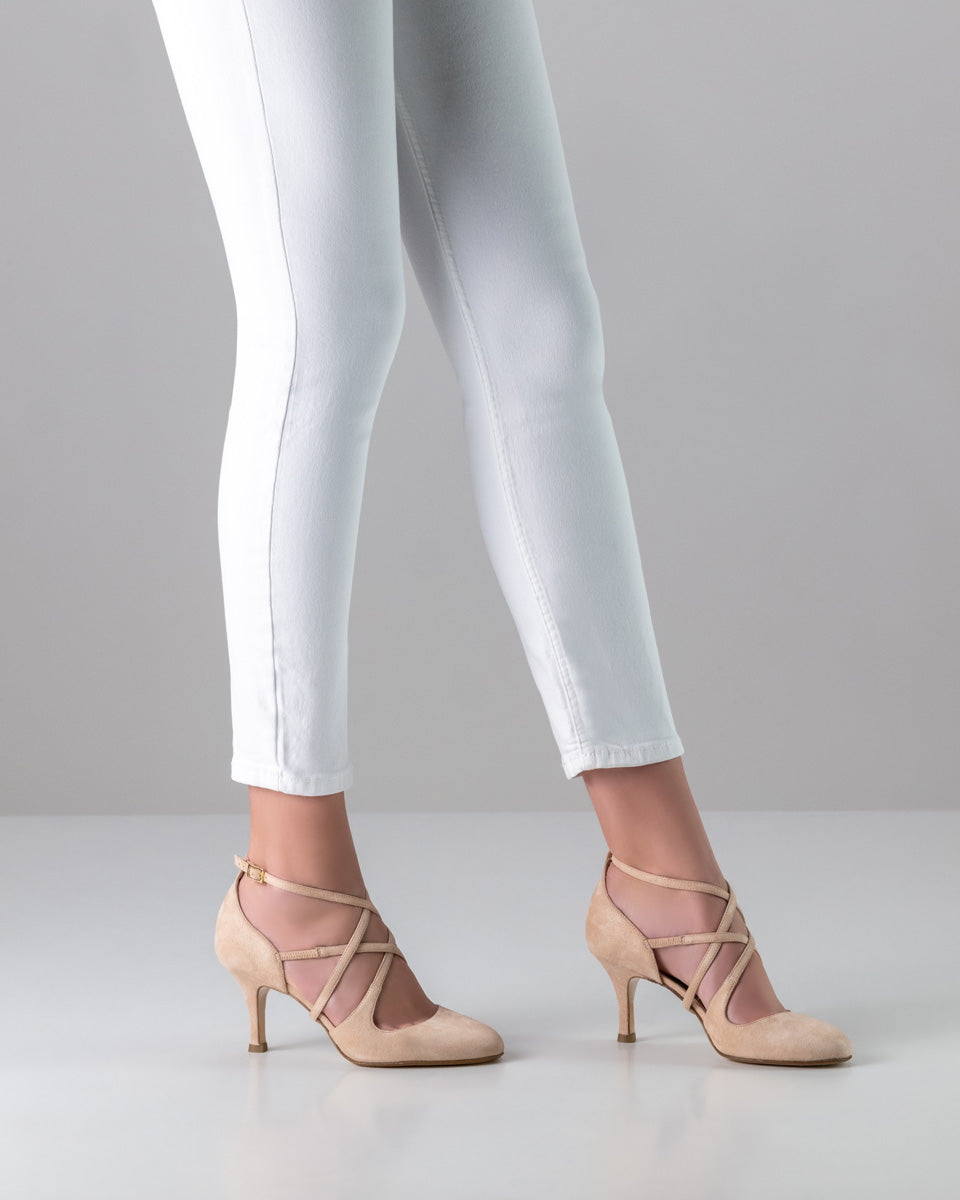 Beige Valeria LS dance shoes with crisscross straps, worn with white jeans for a stylish look.